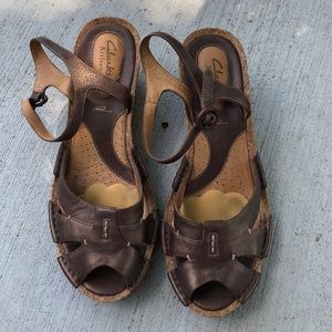 Clark’s wedge sandals with bronze leather